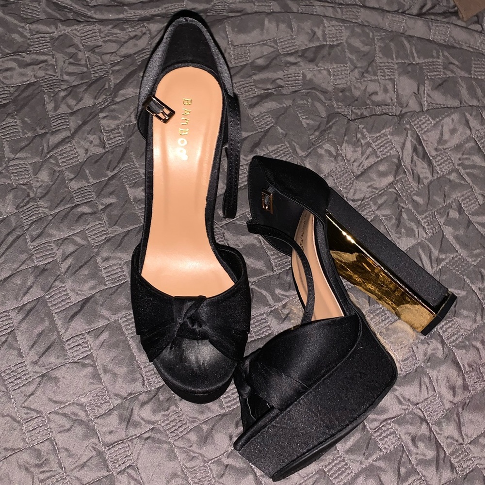 Black and gold heels